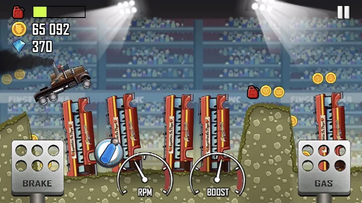 Hill Climb Racing stunt action as the car performs a flip in mid-air, earning points for daring tricks.